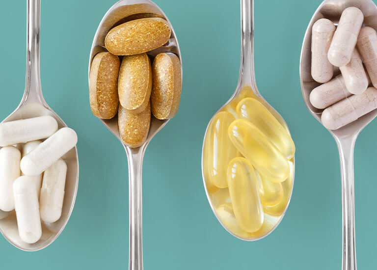 Dietary supplements on spoons